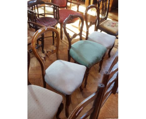 Pair of Victorian rosewood balloon back dining chairs with upholstered stuffover seats, on cabriole legs together with anothe