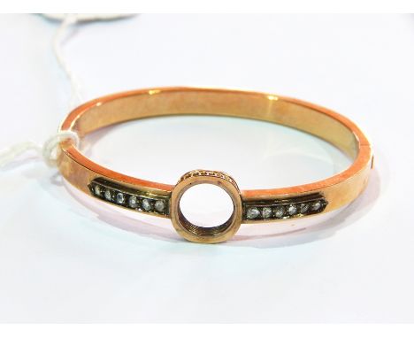 Victorian rose gold and diamond bangle, the hinged bangle with central circular pierced screw fitting (stone missing) flanked