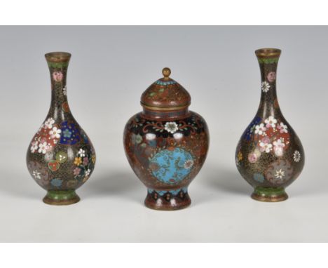 A pair of small Japanese cloisonné enamel bottle vases, Meiji period (1868-1912), the black ground bodies with overall C-scro