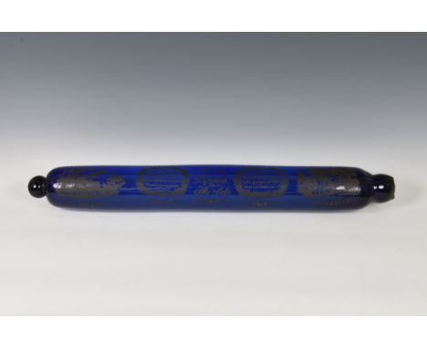 An early 19th century unusually large 'Mariners' Bristol glass cobalt blue rolling pin, gilt transfer printed with steam ship