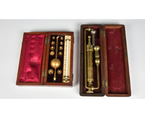 A Sikes hydrometer in fitted case, together with a cased Surgical brass pump. (2)