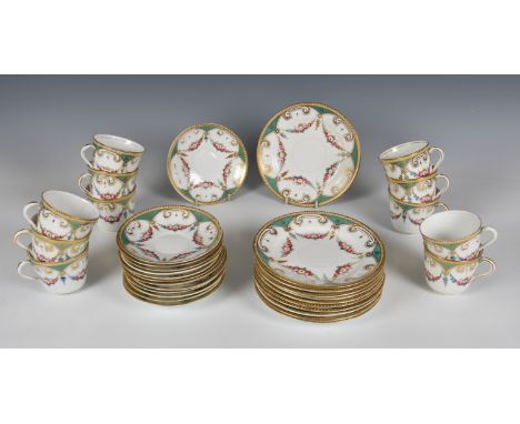 A 19th century English porcelain part tea service, decorated with floral swags on a five lobed flower shaped ground, enriched