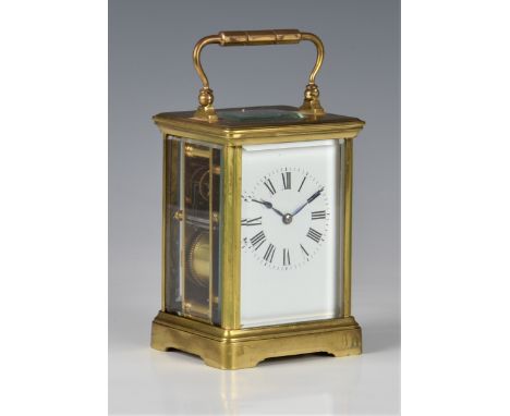 A French gilt brass carriage clock, early 20th century, the twin train movement striking the hours and half hours on a gong, 