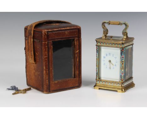A late 19th century brass and champleve enamel repeating carriage clock, the white enamel dial with blue Arabic numerals, uns
