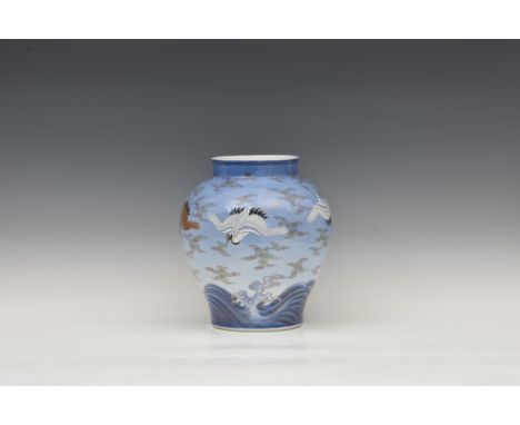 A Japanese Arita porcelain 'cranes' vase by Fukagawa, 20th century, baluster form, painted with five white and gold cranes in