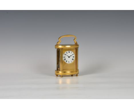 A French oval gilt brass carriage timepiece by Duverdrey &amp; Bloquel, 19th century, the white Roman enamel dial within a ma