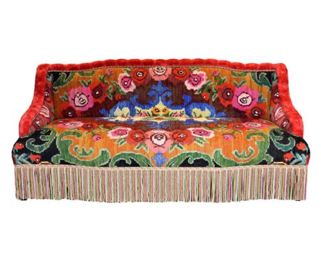 A unique Kiln hand made two seater sofa, of small proportions, richly upholstered, the slightly arched back and swept arms in
