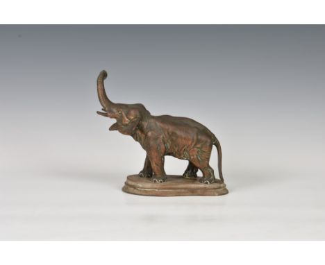 A realistically modeled copper elephant figure, probably early 20th century, modelled with raised trunk, standing upon a oval