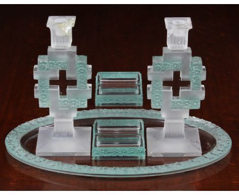 An early 20th century five piece Lalique glass dressing table set, comprising an oval tray with a band of moulded flower head