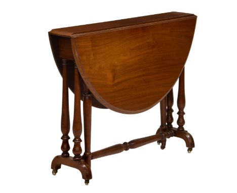 A Victorian mahogany Sutherland table, the oval moulded top over turned twin pillar supports with brass casters and pottery w