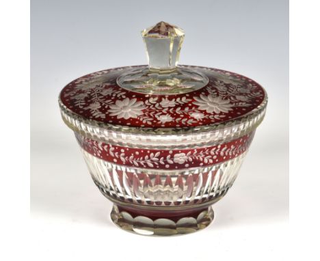 A 19th century Bohemian ruby cut glass lidded bowl, with floral and foliate decoration, 7¼in. (18.4cm.) diameter, 7in. (17.8c