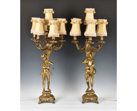 A pair of modern Louis XVI style brass figural table lamp candelabra, each figure holding cornucopia with six cast foliate br