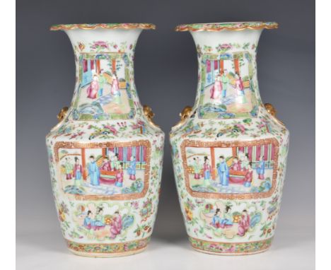 A pair of Chinese Canton famille rose vases, early 19th century, of shouldered, baluster form, with two gilt lion's head and 