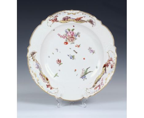 A Chelsea red anchor period moulded porcelain Warren Hastings type platter, c.1755, red anchor mark, of shaped circular form,