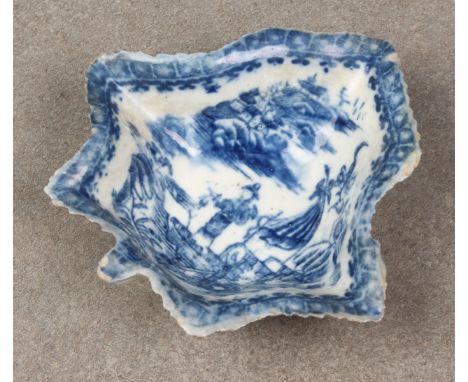 An 18th century Caughley porcelain leaf pickle dish, the well with figures in an Oriental garden scene 3½ x 3¾in. (8.8 x 9.5c