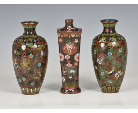 A Japanese cloisonné enamel four sided tapered vase, Meiji period (1868-1912), the black ground with all-over C-scroll decora