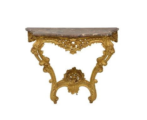 A Louis XV style carved giltwood console table, the mottled red, grey and white marble top with serpentine front and sides, o