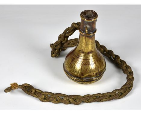 An unusual 18th century heavy brass flask with twin loops and cord, extensively inscribed in an 18th century hand beneath, 5 