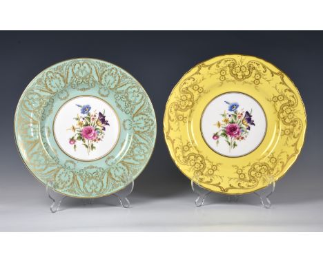 Two Royal Worcester bone china plates, black printed factory marks, painted with sprays of garden flowers within gilt enriche