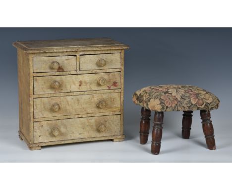 A stained pine apprentice piece chest, the moulded top over two short and three long graduated drawers with turned wooden han