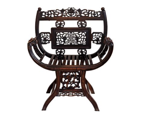 A Chinese carved hardwood ram's horn arm chair, probably late 19th century, the back with a central pierced panel and six sma