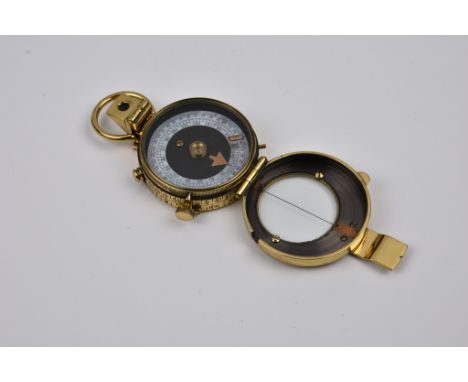 A WW1 brass Verners Pattern compass by T. Wheeler, with MOP dial, with impressed broad arrow mark, no. 21515, dated 1915, 2 1