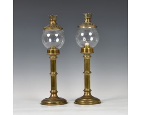 A pair of brass campaign style travelling candle lamps by Sherwood Ltd. of Birmingham, first quarter 20th century, the candle