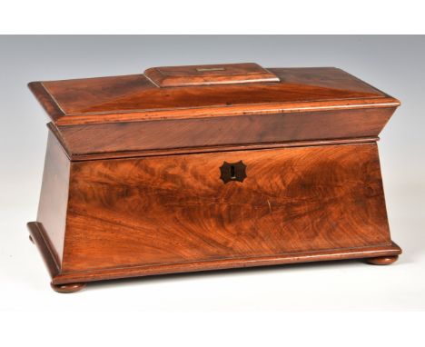 A mid-19th century mahogany tea caddy, of sarcophagus form, with VR lock plate and inlaid escutcheon, small inlaid silver pla