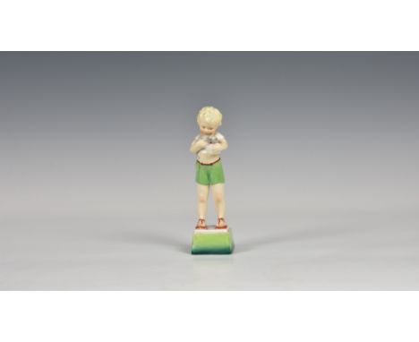 A Royal Worcester Days of the week figure, No.3281, Friday's child is loving and giving (boy with kitten), 7in. (17.8cm.) hig