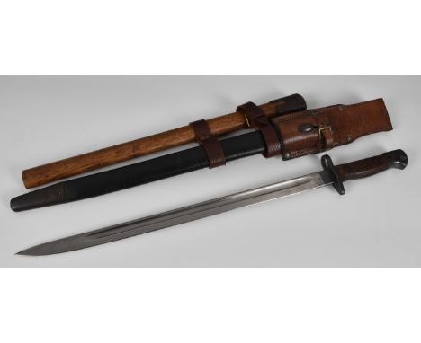 A British pattern 1907 bayonet by Wilkinson, leather scabbard, the 17in. single edge blade fuller, with various proof marks, 