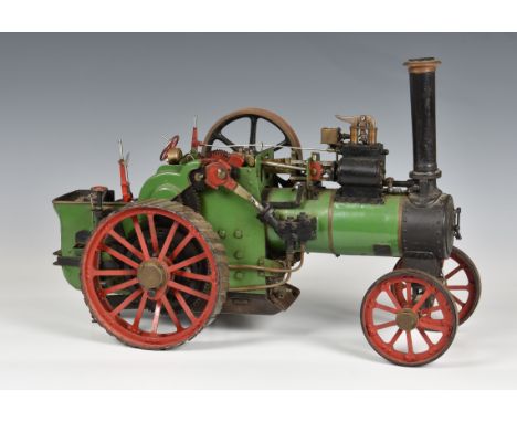 A 1 inch scale live steam model of a traction engine, built to the L.C. Mason design 'Minnie', finished in green red and blac