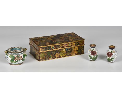 A Chinese cloisonne and gilt copper enamel box, 20th century, of rectangular form, with all over floral decoration on a dark 