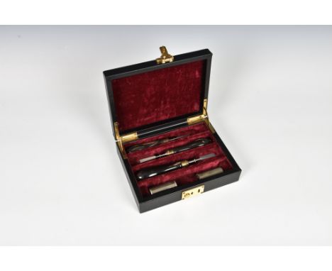 A cased Purdey &amp; Sons sporting tool set, the brass and polished steel tools with turned horn handles, in a fitted velvet-