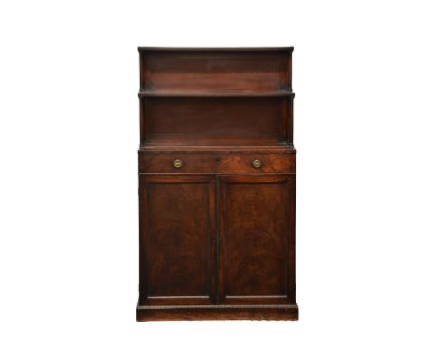 A Regency mahogany chiffonier, with two stepped shelves on turned column supports over a rectangular top with a single frieze