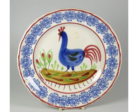 A LLANELLY POTTERY COCKEREL PLATE typically decorated with light-blue sponged rosette motifs to the border, 24.5cms diam