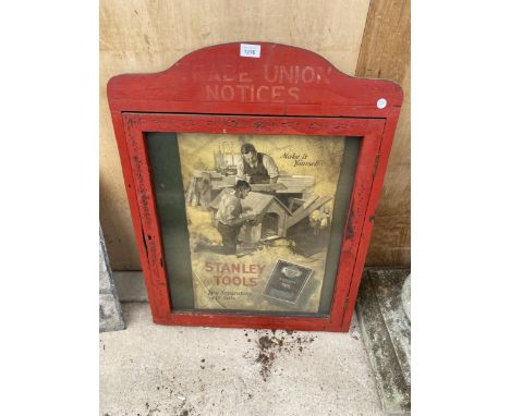 A VINTAGE WOODEN 'TRADE UNION NOTICES' DISPLAY BOARD WITH A VINTAGE 'STANLEY TOOLS' POSTER 