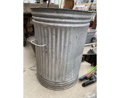 A GALVANISED DUST BIN/PLANTER 