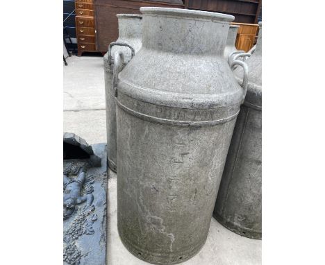 A VINTAGE MILK CHURN 