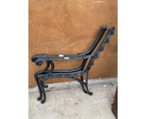 A PAIR OF VINTAGE CAST IRON BENCH ENDS 