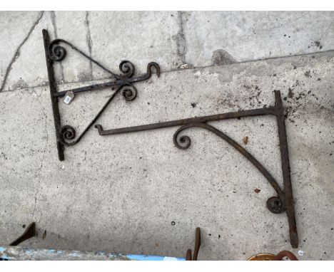 TWO VINTAGE WALL MOUNTED CAST IRON HANGING BRACKETS 
