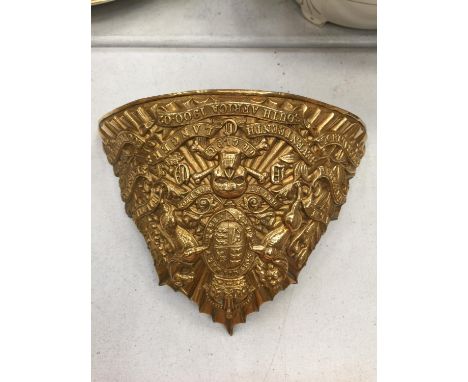 A BRASS BADGE FROM AN ARMY HELMET 