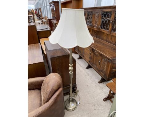 A MODERN METALWARE STANDARD LAMP COMPLETE WITH SHADE 