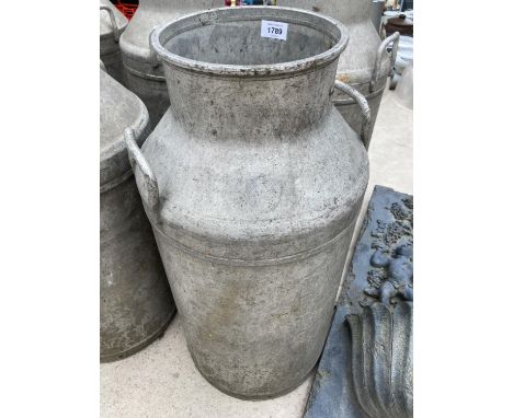 A VINTAGE MILK CHURN 
