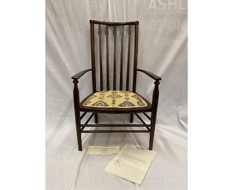 AN EARLY 20TH CENTURY LIBERTY BIRMINGHAM BEECH NURSING CHAIR WITH TURNED LEGS AND STRETCHERS, ARROW STLYE UPRIGHTS, UPHOLSTER