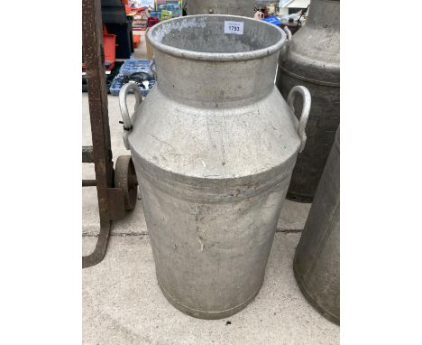 A VINTAGE MILK CHURN 