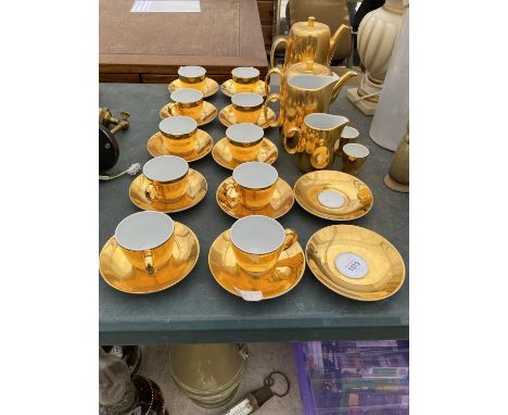 A GILT ROYAL WORCESTER PART TEA SERVICE TO INCLUDE MILK JUG, CUPS AND SAUCERS AND COFFEE POT ETC 