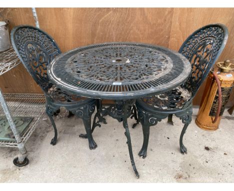 A VINTAGE CAST ALLOY BISTRO SET COMPRISING OF A ROUND TABLE AND TWO CHAIRS 