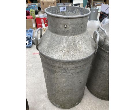 A VINTAGE MILK CHURN 