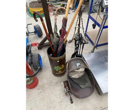 AN ASSORTMENT OF ITEMS TO INCLUDE A COPPER COAL SKUTTLE, A COPPER CANON FIRE POKER AND A STICK STAND WITH VARIOUS WALKING STI