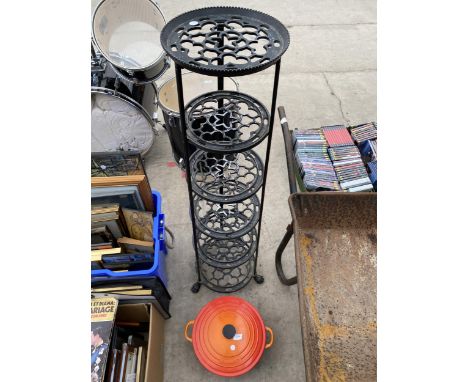 A SIX TIER PAN STAND AND A LE CRUSET TWIN HANDLED COOKING POT 